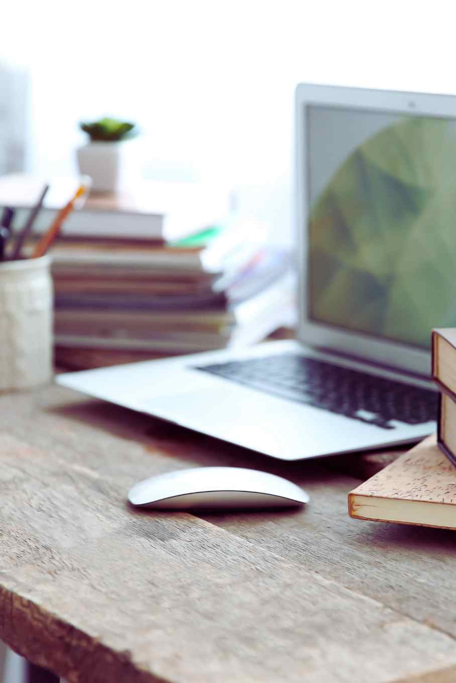 Picture of books and computer on desk